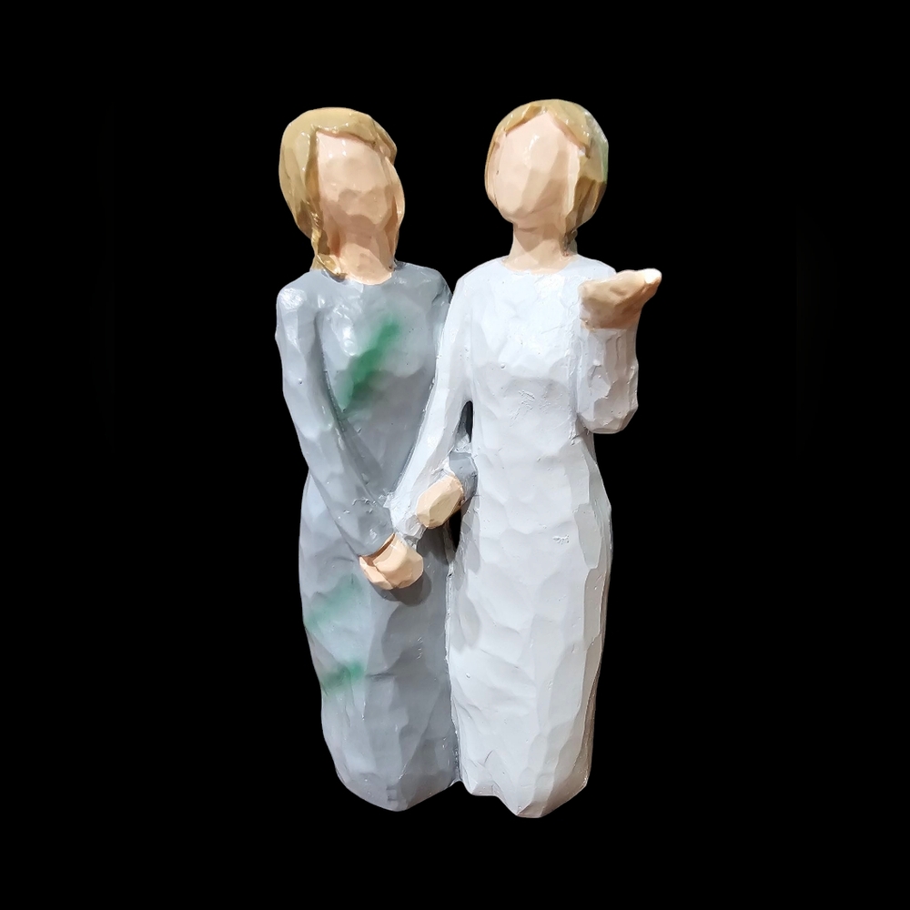 Handcrafted Figurine with Gray and White Attire‎